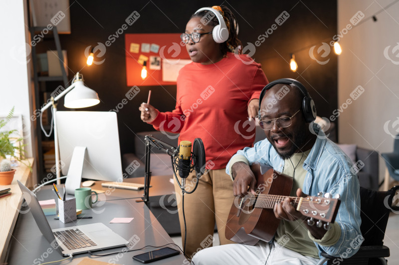 Couple of musicians recording a song