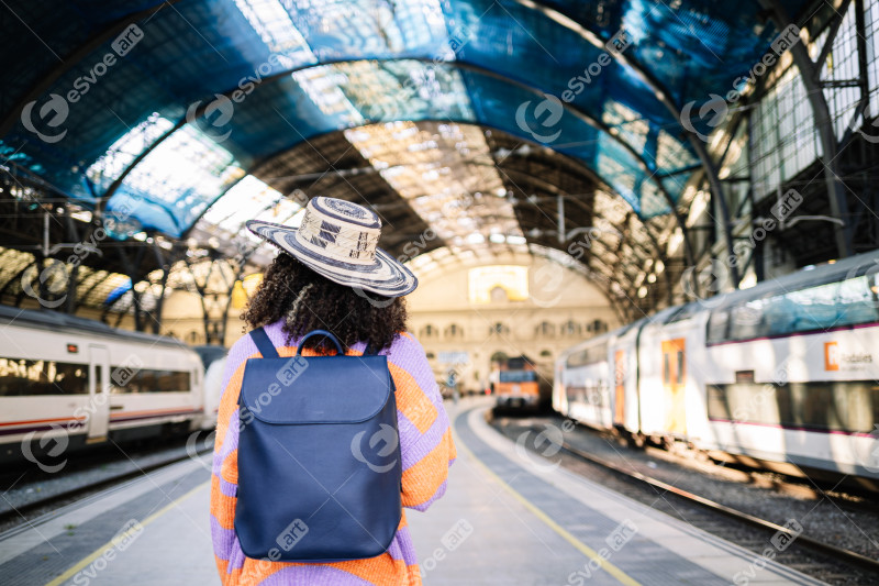 Female traveler waiting for train on platform