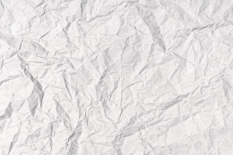 Gray Crumpled paper background texture. Full frame