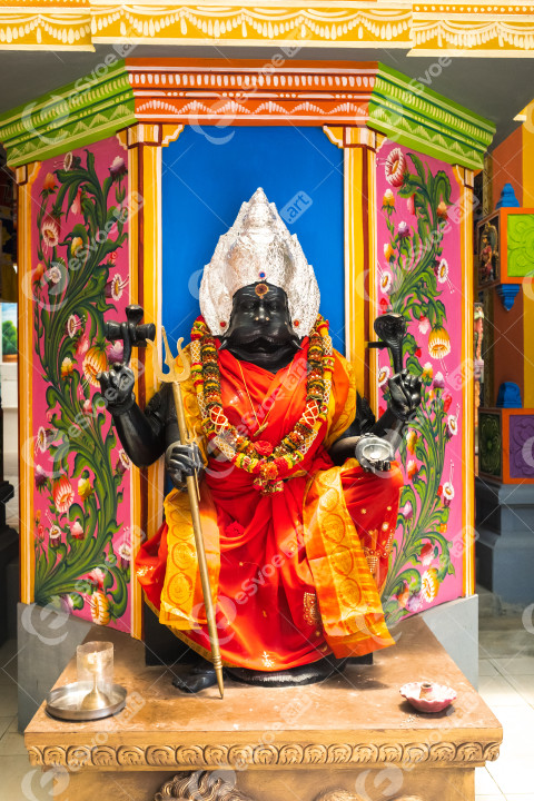 Part of a beautiful and colorful Indian temple in Mauritius Island. Close-up on sculptures and statues of Indian deities