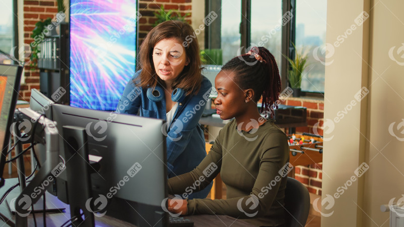 People doing teamwork to develop new interface in agency office