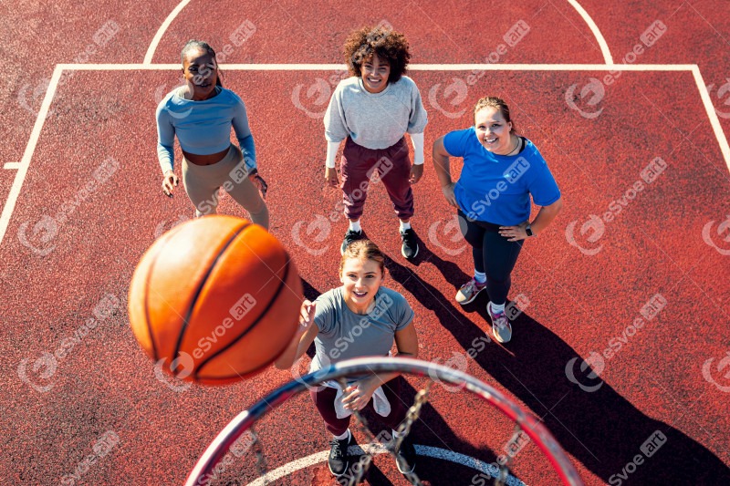 Portait of diverse group of young woman having fun playing baske