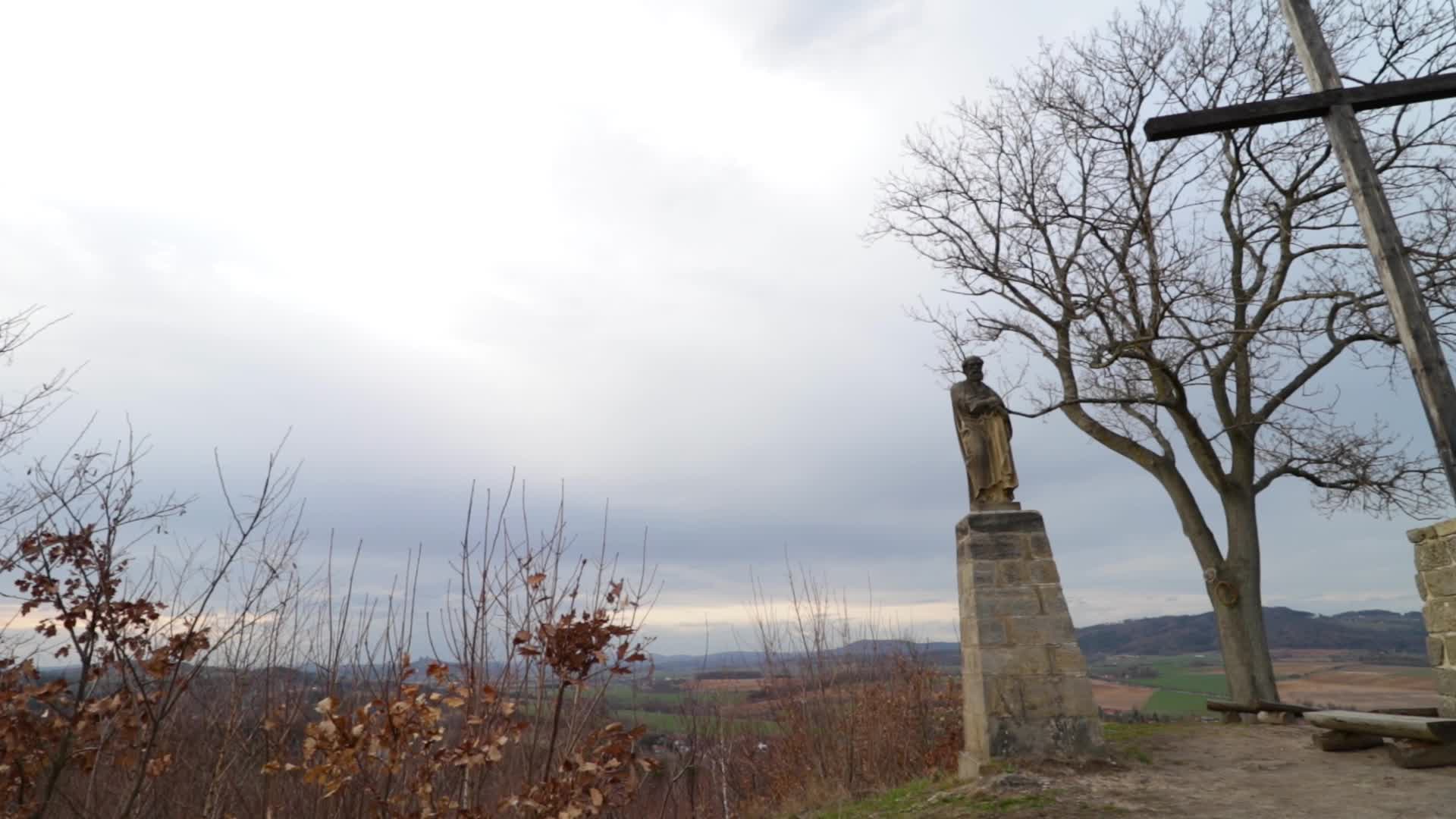 Two statues and a wood