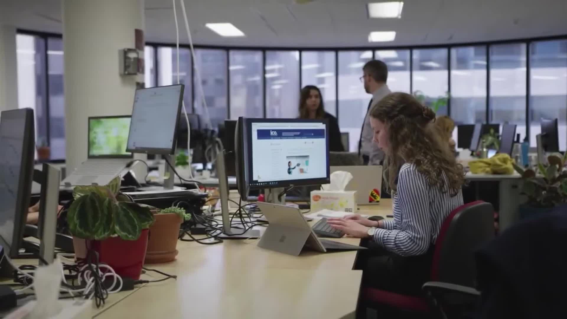 People work on a computer in a business center