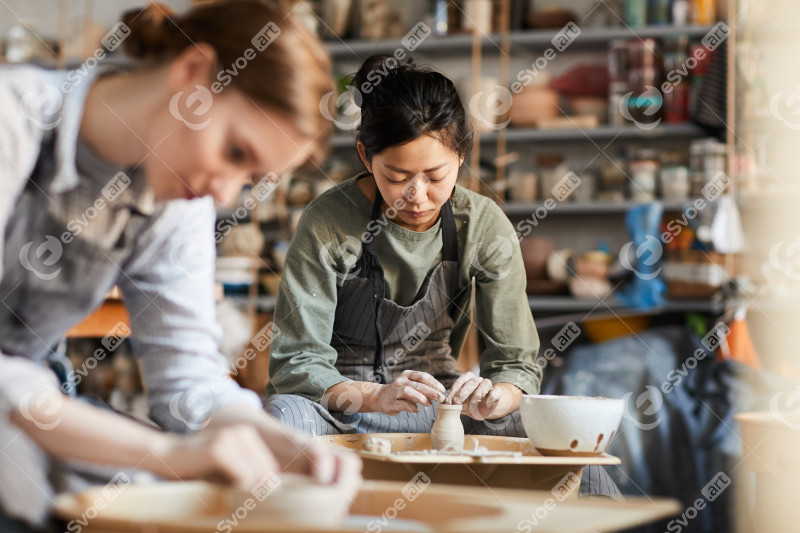 Skilled potter making clay vase