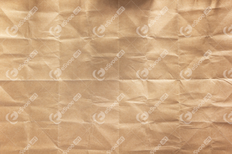 Wrinkled paper texture as background texture. Folded craft paper